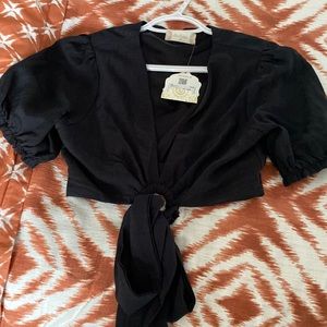 Brand altar’d state with a tie to the front and elastic sleeves